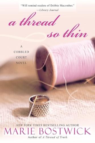 A Thread So Thin  by Marie Bostwick at Abbey's Bookshop, 
